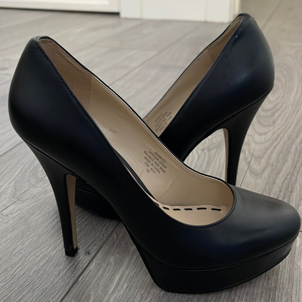 Black heeled pumps, leather, never worn, just tried on around the house